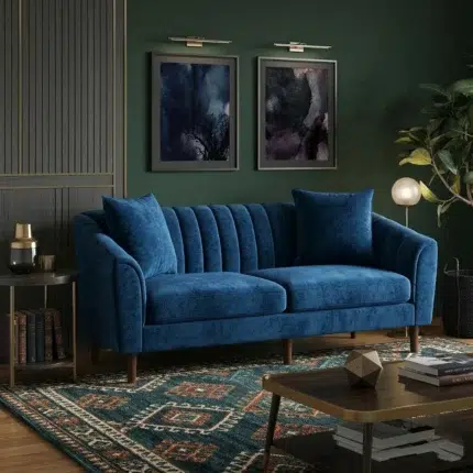 Modern 2 seater blue velvet sofa with curved arms, channel tufted backrest, wooden legs in a luxury contemporary living room setting UAE