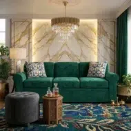 Luxury emerald green velvet rolled arm sofa with patterned cushions in elegant modern living room with marble wall and chandelier UAE