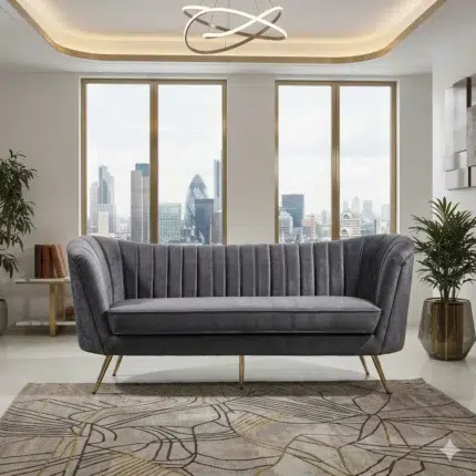 Modern grey velvet 3 seater sofa with curved channel tufted back and gold metal legs in luxury living room UAE with city view