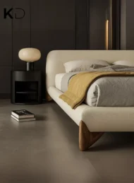 Astoria Modern Cream Upholstered Bed with curved headboard and wooden legs for luxury bedroom furniture Dubai UAE