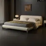 Astoria Modern Cream Upholstered Bed with curved headboard and wooden legs for luxury bedroom furniture Dubai UAE