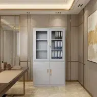 Elgraviax steel storage cabinet for office furniture with sliding glass doors, lower lockable storage, and light grey steel finish in a modern UAE office.