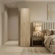 Lunorvex wooden wardrobe for office furniture and home use with two doors, lower drawers, and natural wood finish in a modern UAE interior.