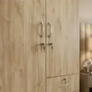 Lunorvex wooden wardrobe for office furniture and home use with two doors, lower drawers, and natural wood finish in a modern UAE interior.